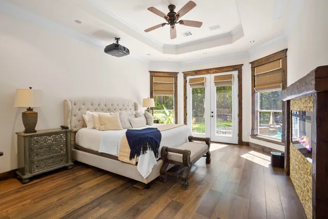a bathroom with a granite countertop sink mirror and shower