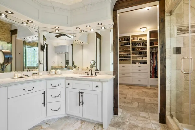 a kitchen with stainless steel appliances granite countertop a sink a stove and a refrigerator