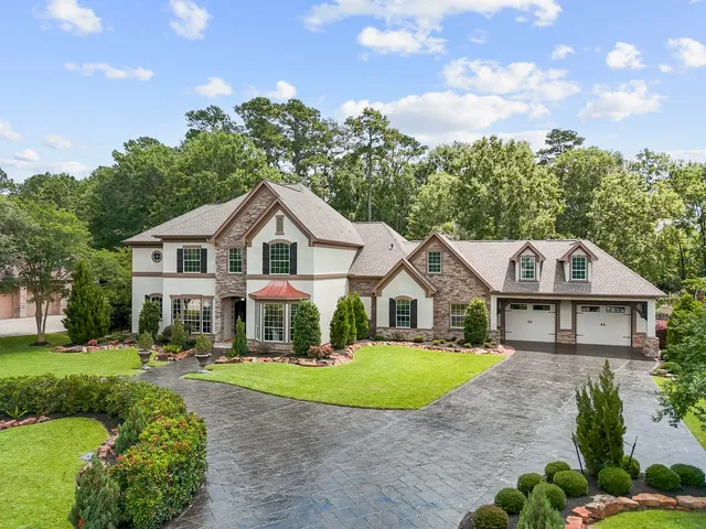 an aerial view of multiple houses with yard