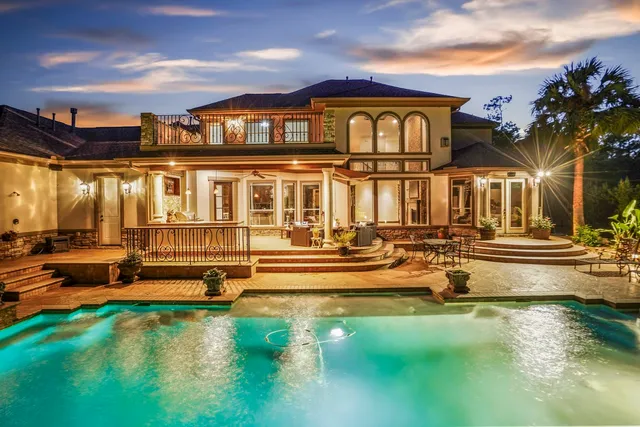 a view of a house with swimming pool