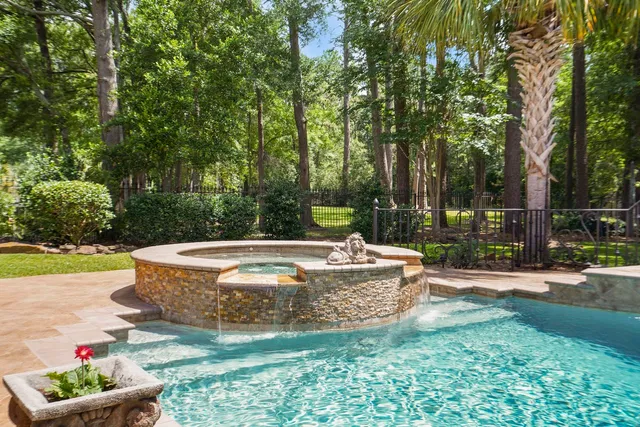 a view of a swimming pool with a patio