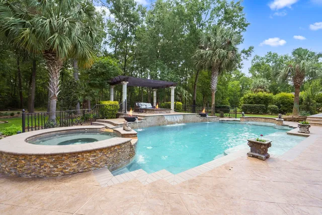 a outdoor space with couches a barbecue grill and a potted plant