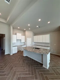a spacious bathroom with a mirror and a shower