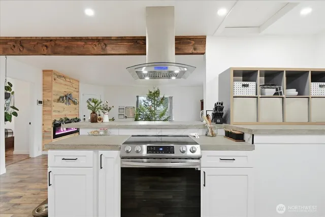 a kitchen with stainless steel appliances granite countertop a stove and a sink