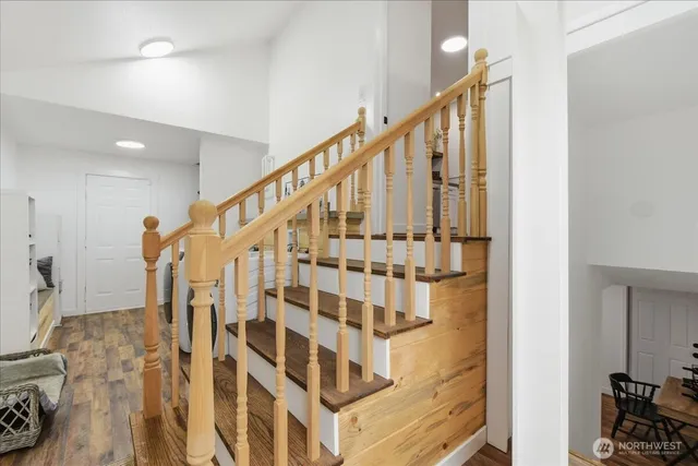 a view of staircase with wooden floor and stairs
