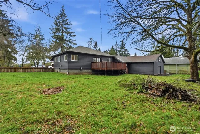 a view of house with backyard