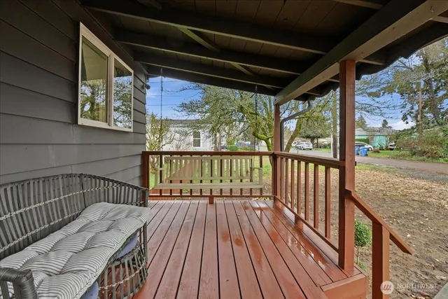 a view of balcony with wooden floor