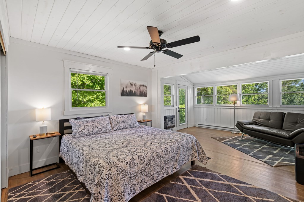 760 River Bend Lane Blue Ridge, GA 30513 - Photo 34 of 101 a bedroom with a large bed and a window