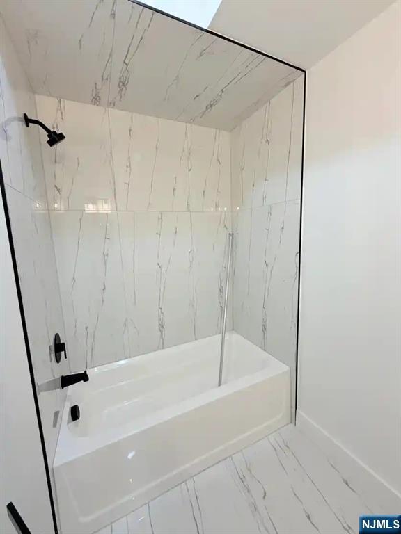 39 South 7th Street, Unit 2 3 Newark, NJ 07107 - Photo 12 of 13 a white bath tub sitting next to a shower