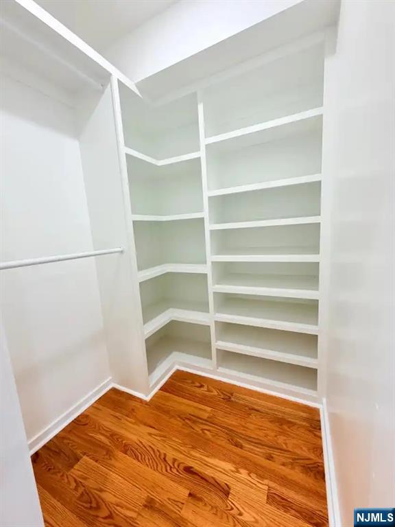 39 South 7th Street, Unit 2 3 Newark, NJ 07107 - Photo 9 of 13 a view of a room with empty racks