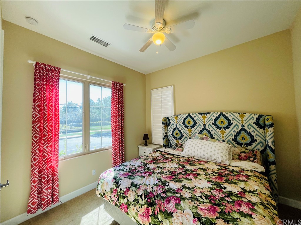 71 Thornapple Irvine, CA 92620 - Photo 17 of 18 a bedroom with a bed and a chandelier