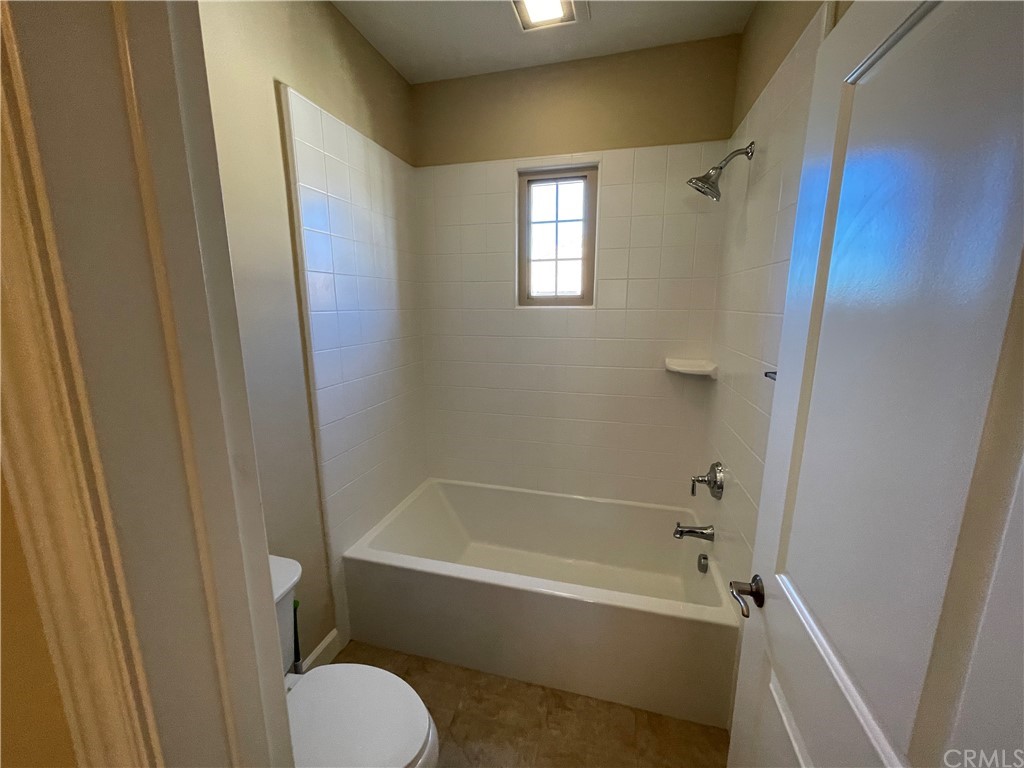 71 Thornapple Irvine, CA 92620 - Photo 6 of 18 a bathroom with a tub and shower