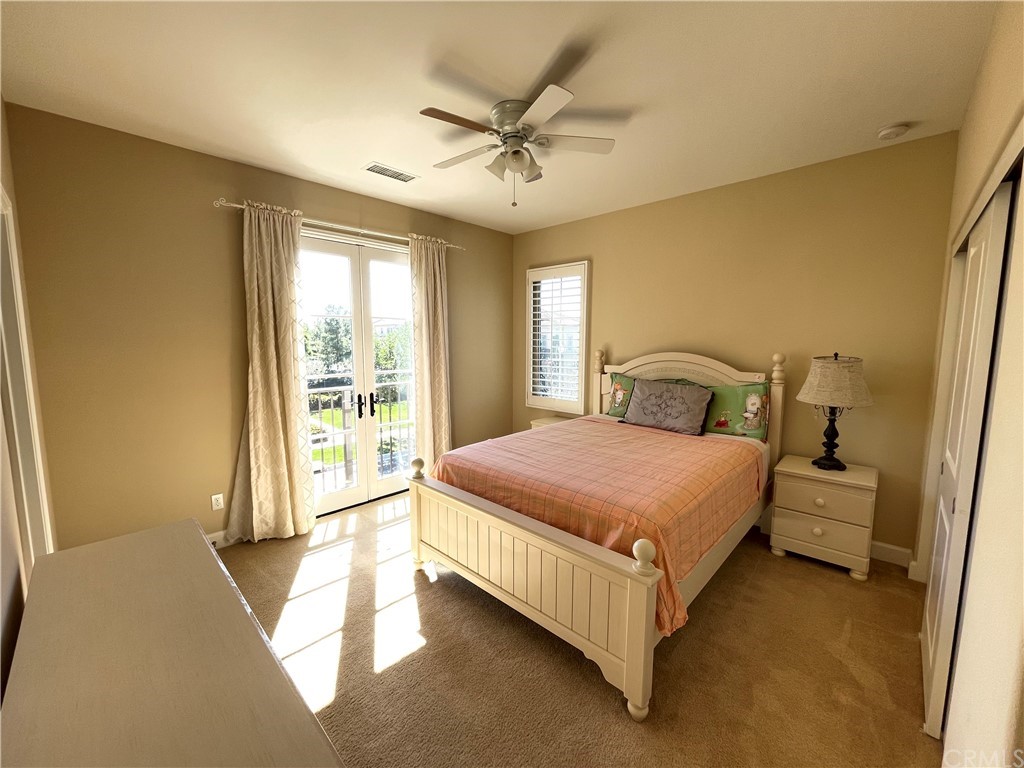 71 Thornapple Irvine, CA 92620 - Photo 8 of 18 a bedroom with a bed and window