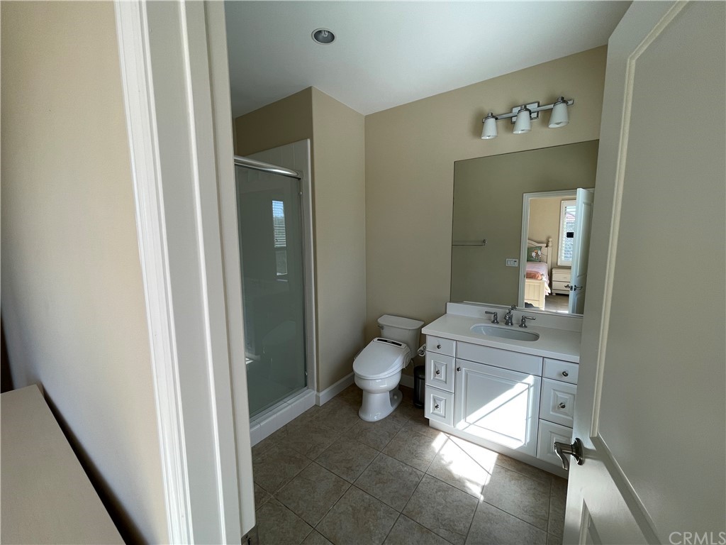 71 Thornapple Irvine, CA 92620 - Photo 9 of 18 a bathroom with a sink a toilet and mirror