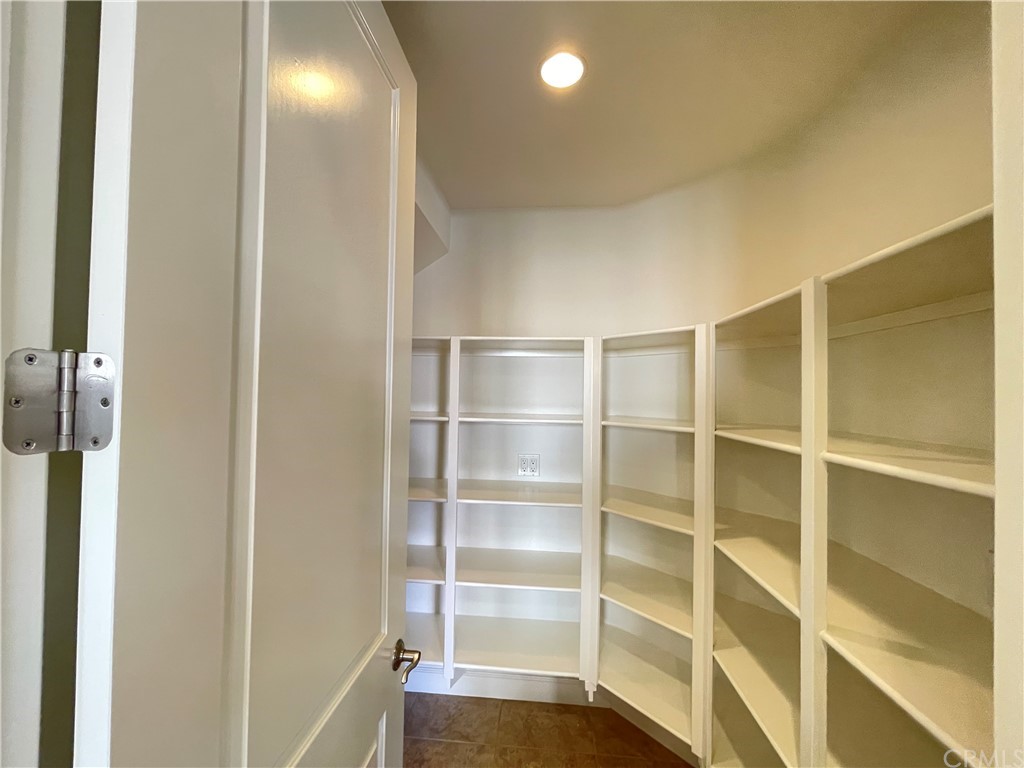 71 Thornapple Irvine, CA 92620 - Photo 10 of 18 a view of an empty room with empty racks