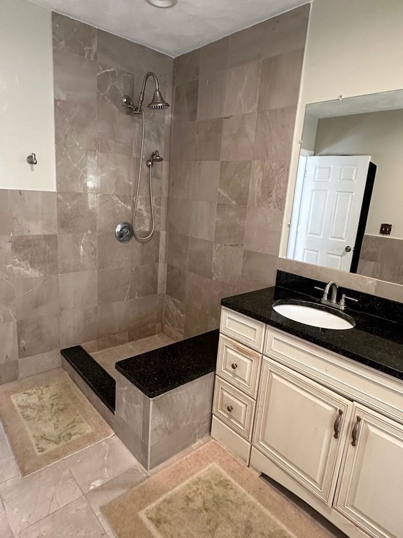 5 Telo Road Windham, NH 03087 - Photo 15 of 23 a bathroom with a granite countertop sink a toilet and a mirror