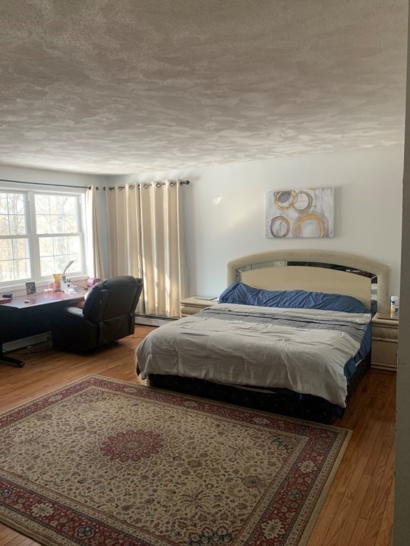 5 Telo Road Windham, NH 03087 - Photo 18 of 23 a bedroom with a bed and a couch