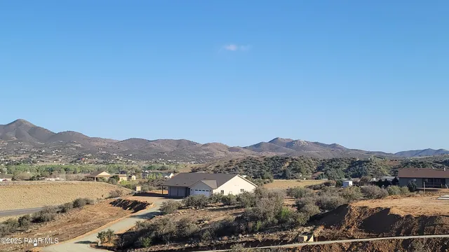 a view of a town with mountains in the background