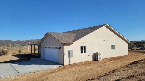 a view of storage and utility room with wooden floor