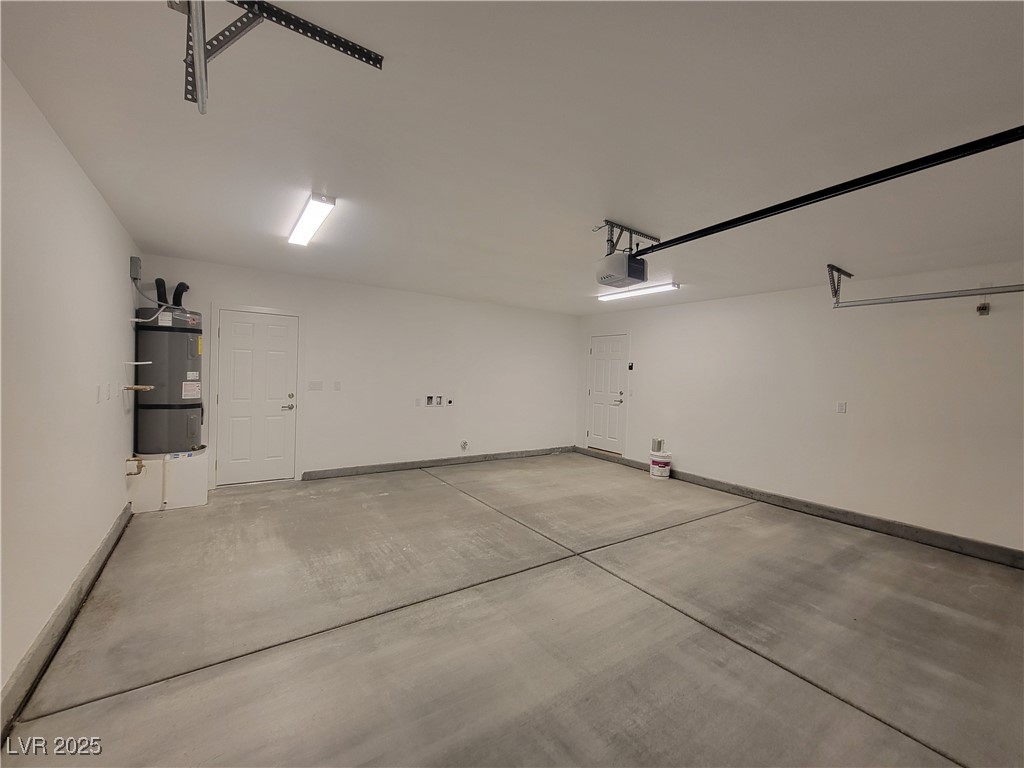 1021 East Manse Road Pahrump, NV 89048 - Photo 22 of 25 Garage with secured water heater and baseboards