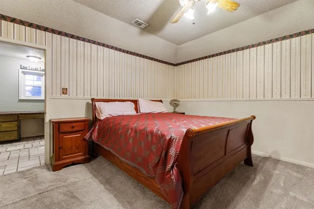 a bedroom with a bed and a cabinets