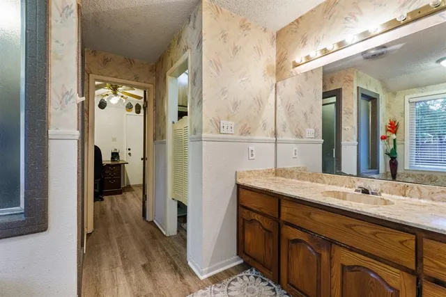 a bathroom with a double vanity sink and a mirror