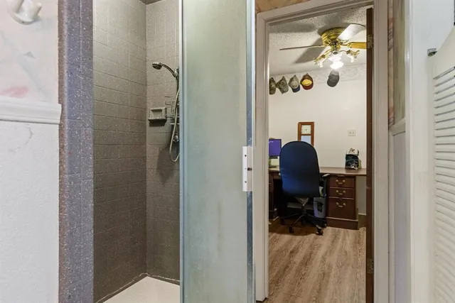 a view of a bedroom with a workspace