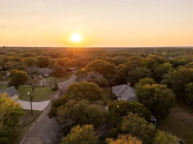 an aerial view of residential house and green space