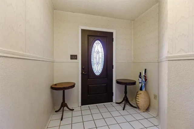 a bathroom with a toilet and a mirror