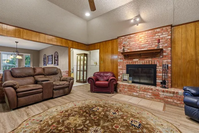 a living room with furniture window and a fireplace