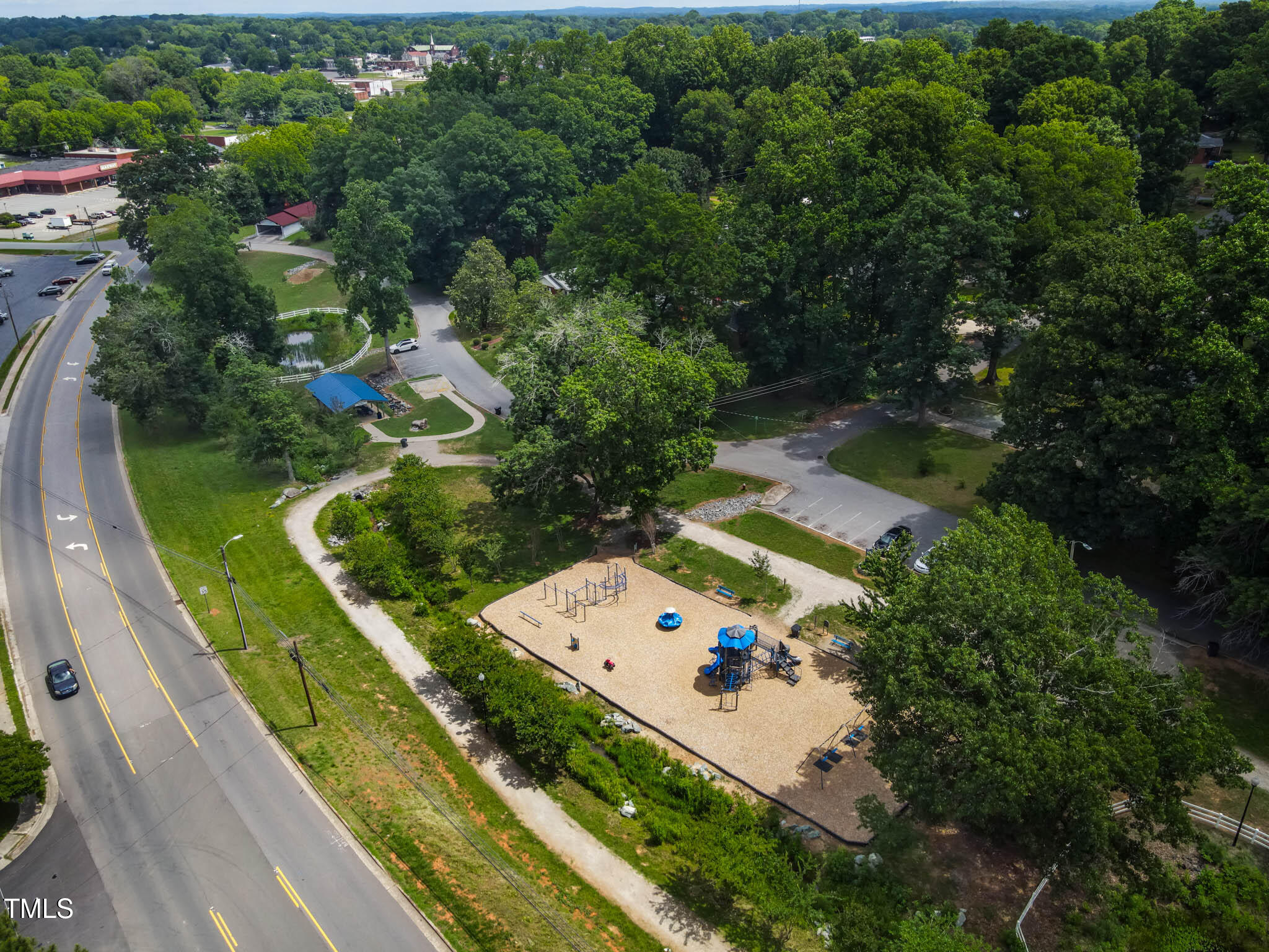 519 West Raleigh Street Siler City, NC 27344 - Photo 15 of 47 an aerial view of a house with a garden and swimming pool