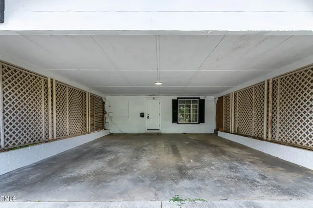 a view of a room with large windows and city view