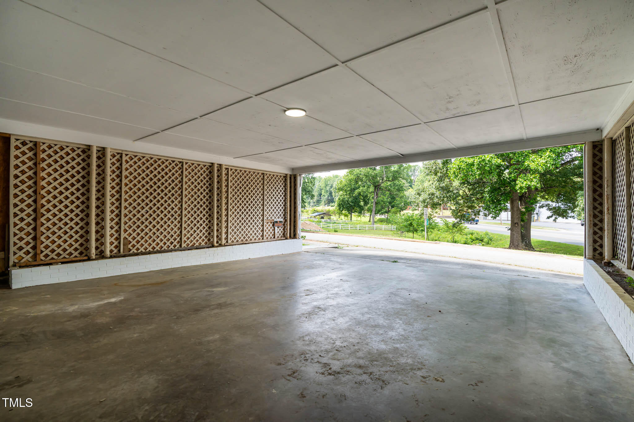 519 West Raleigh Street Siler City, NC 27344 - Photo 22 of 47 a view of a room with large windows and city view