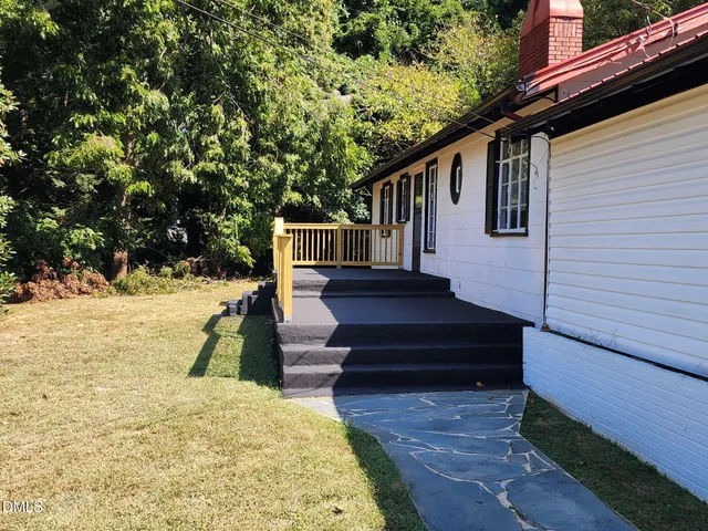 a view of a back yard with a house