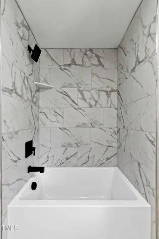 a kitchen that has a sink and a stove in it