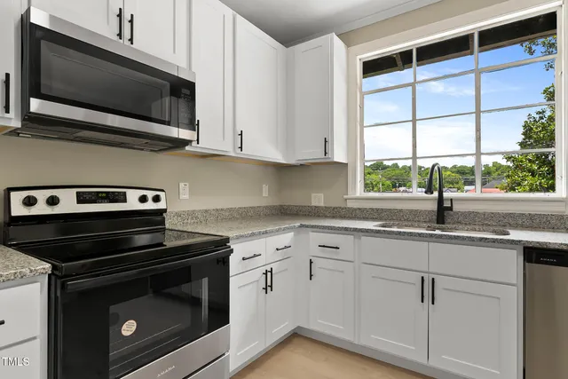 a kitchen with a sink and window