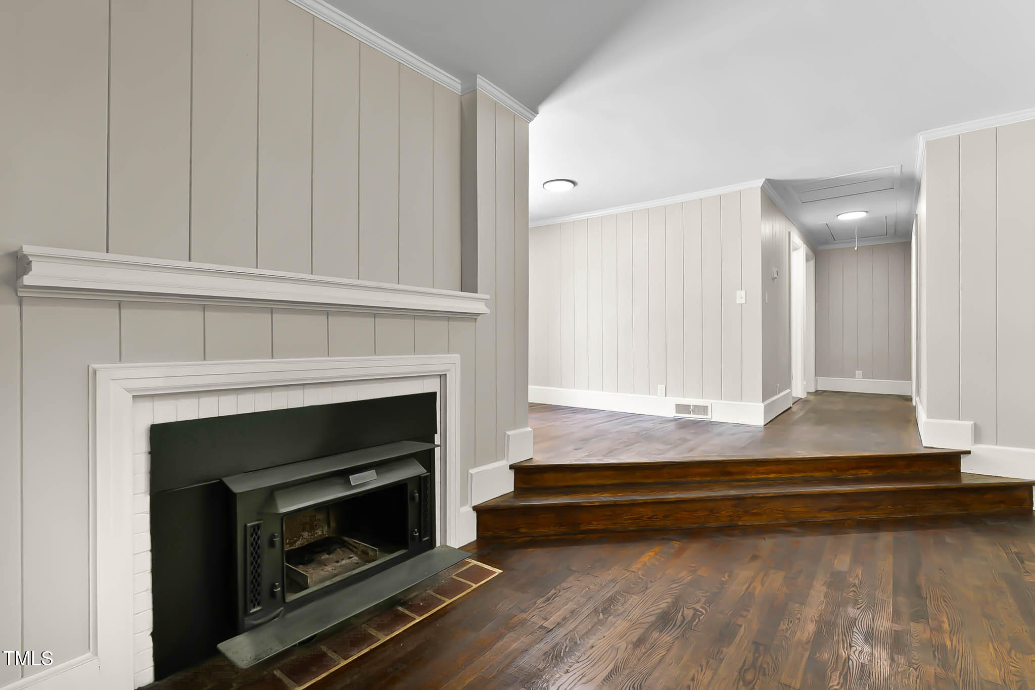 519 West Raleigh Street Siler City, NC 27344 - Photo 46 of 47 a room with fireplace and a wooden cabinets