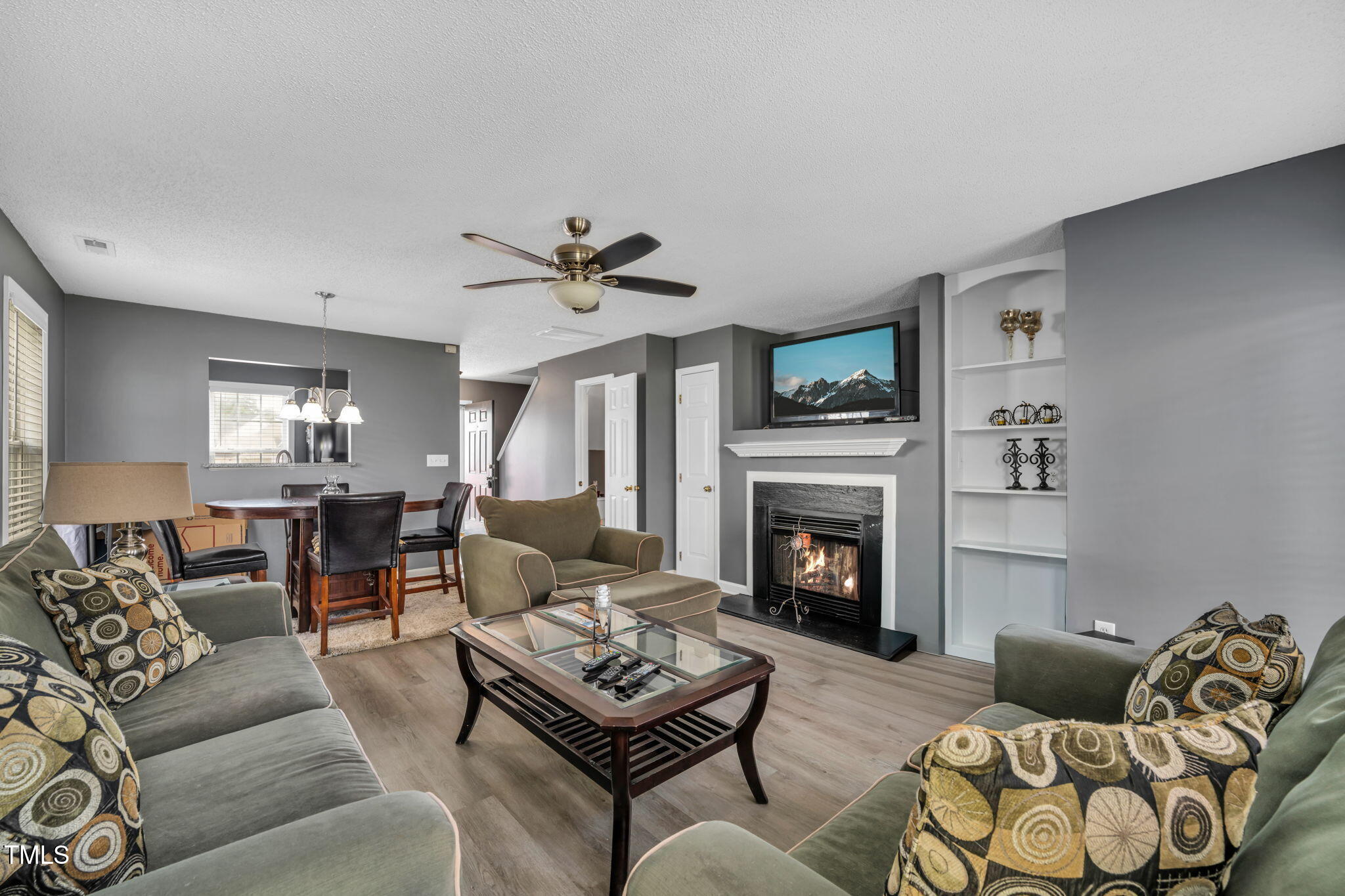 2203 Whistling Straits Way Raleigh, NC 27604 - Photo 5 of 31 a living room with furniture and a fireplace