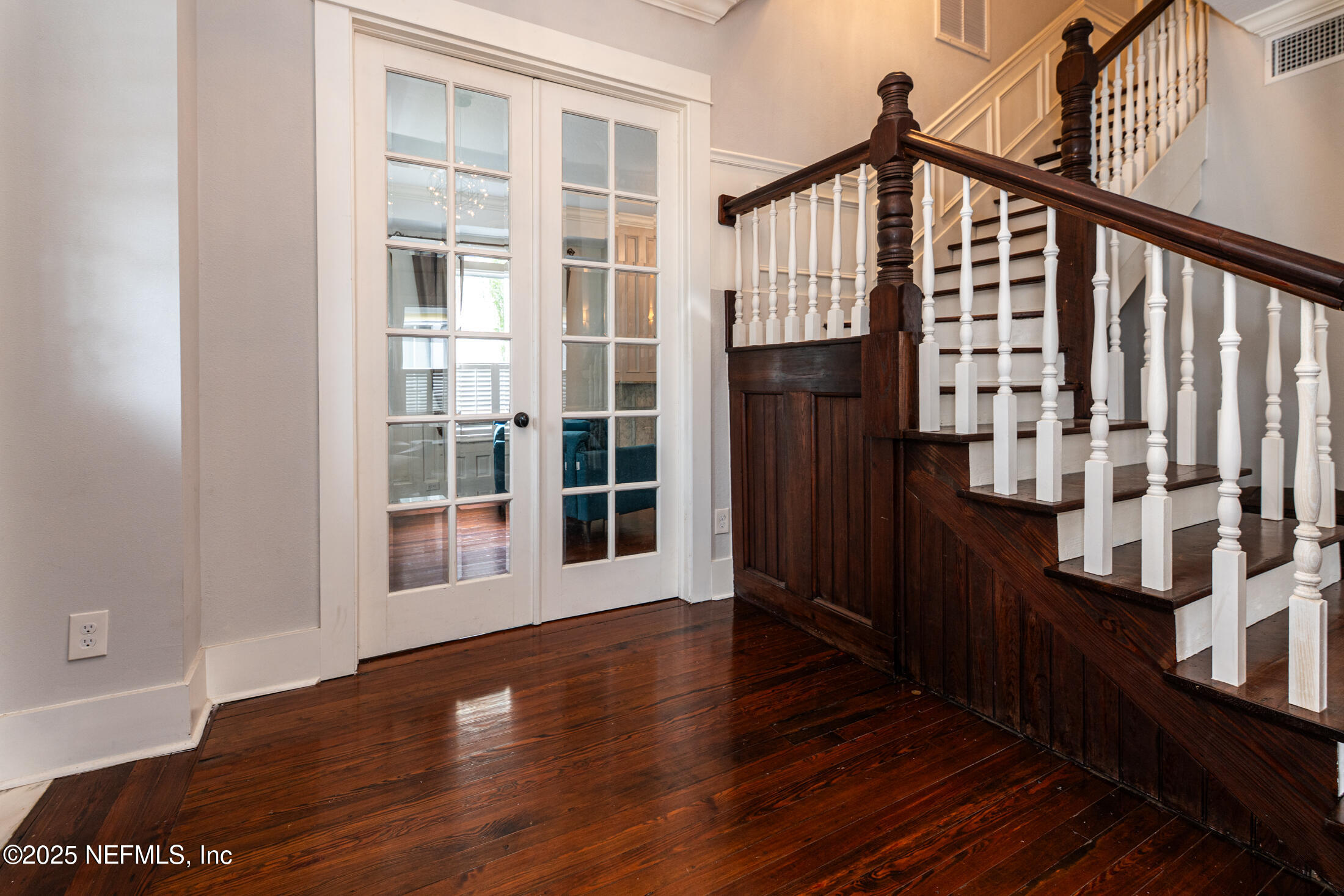 56 Water Street St. Augustine, FL 32084 - Photo 11 of 61 a view of an entryway with wooden floor and door