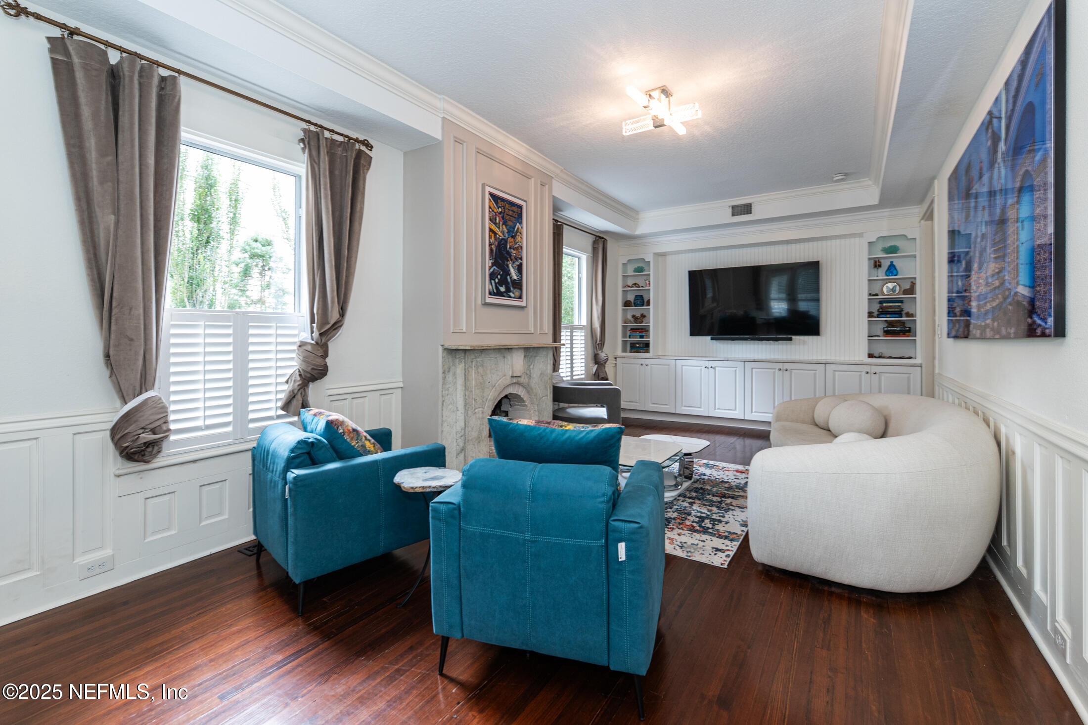 56 Water Street St. Augustine, FL 32084 - Photo 12 of 61 a living room with furniture and a flat screen tv