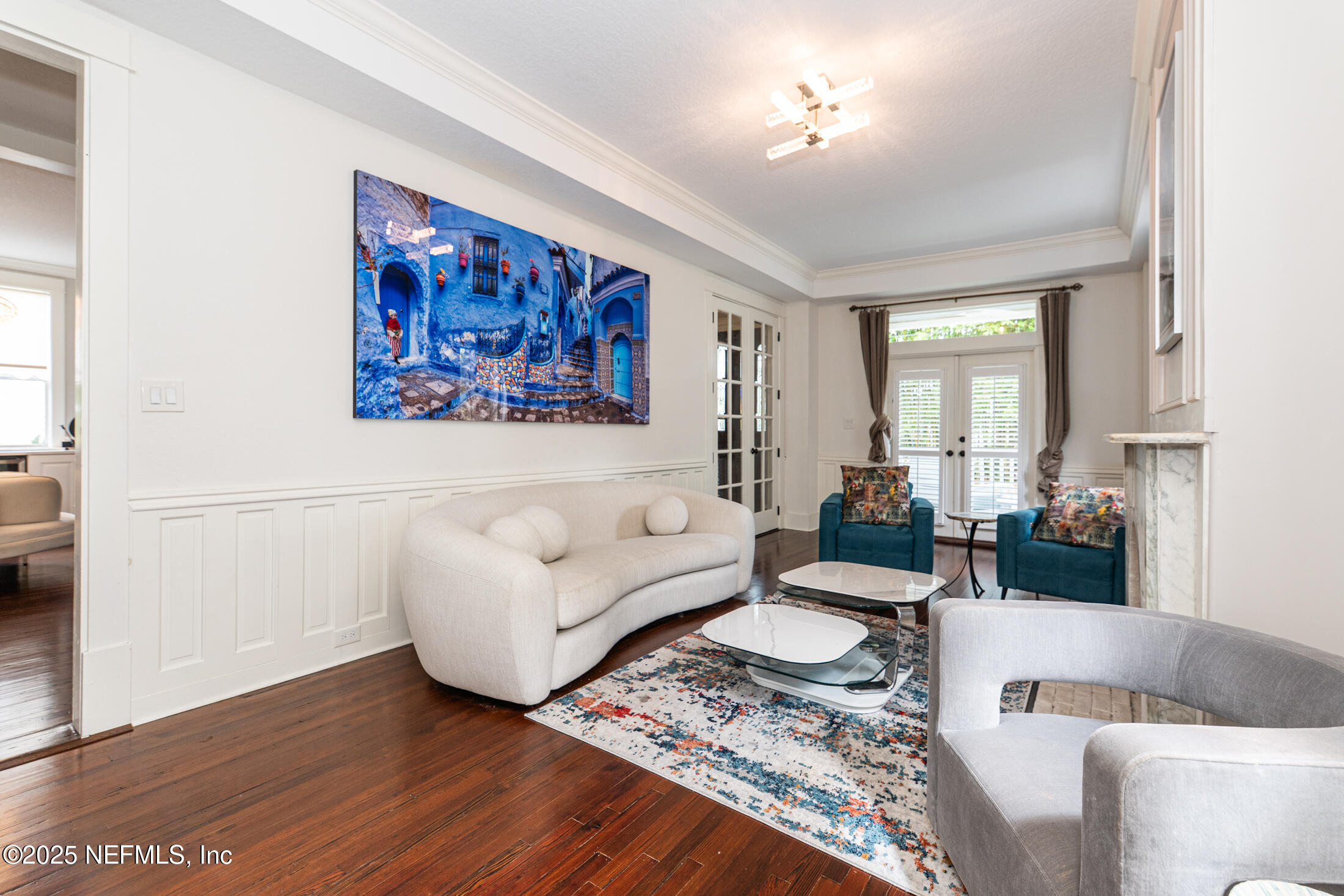 56 Water Street St. Augustine, FL 32084 - Photo 13 of 61 a living room with furniture and a painting on the wall