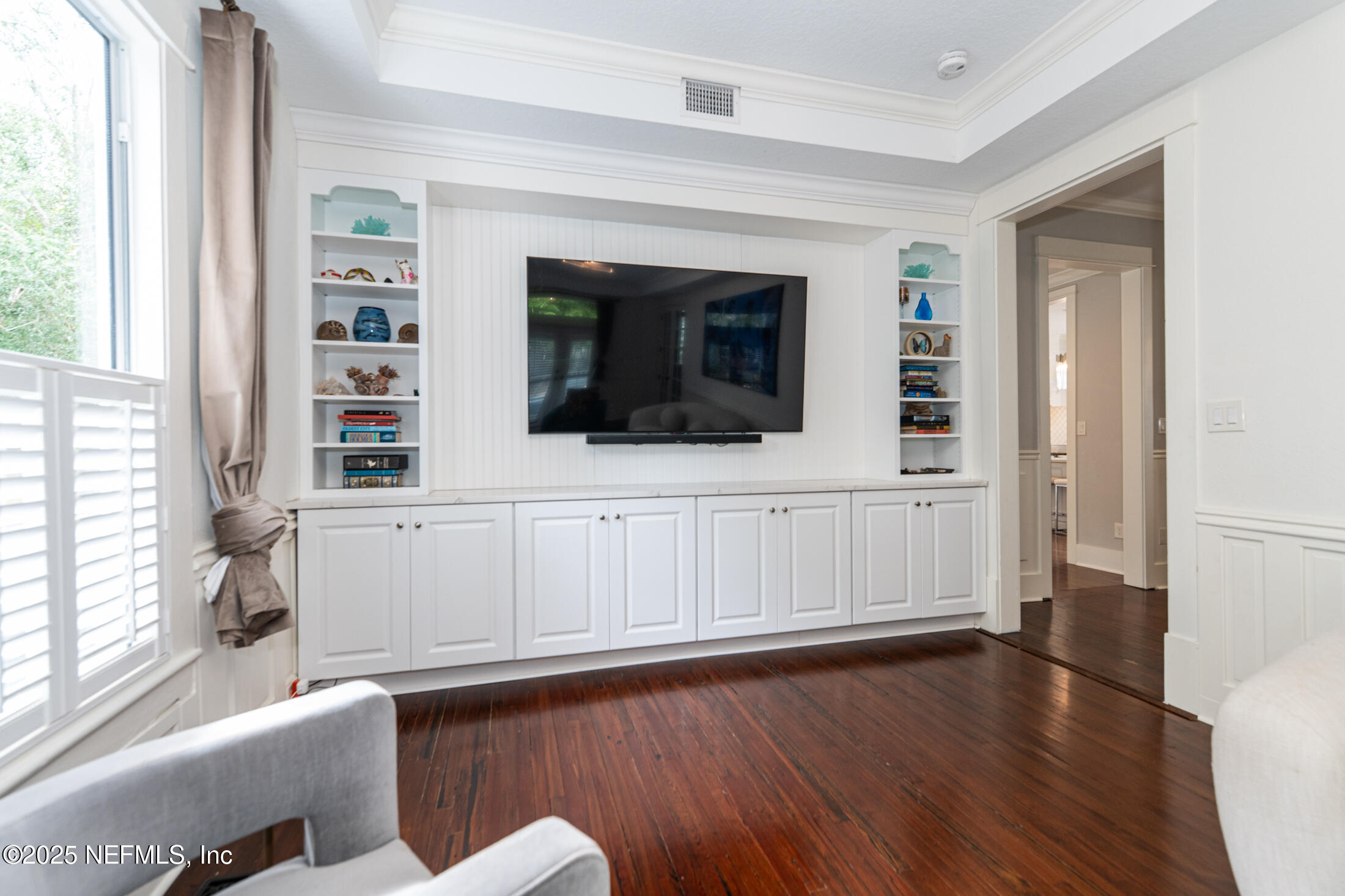 56 Water Street St. Augustine, FL 32084 - Photo 15 of 61 a living room with furniture and a flat screen tv