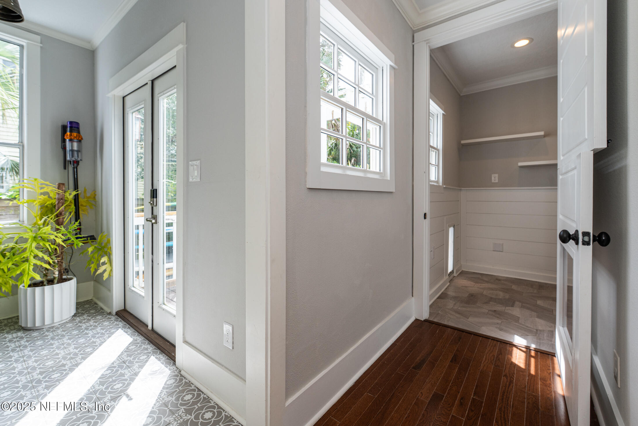 56 Water Street St. Augustine, FL 32084 - Photo 29 of 61 a view of entryway with wooden floor and front door