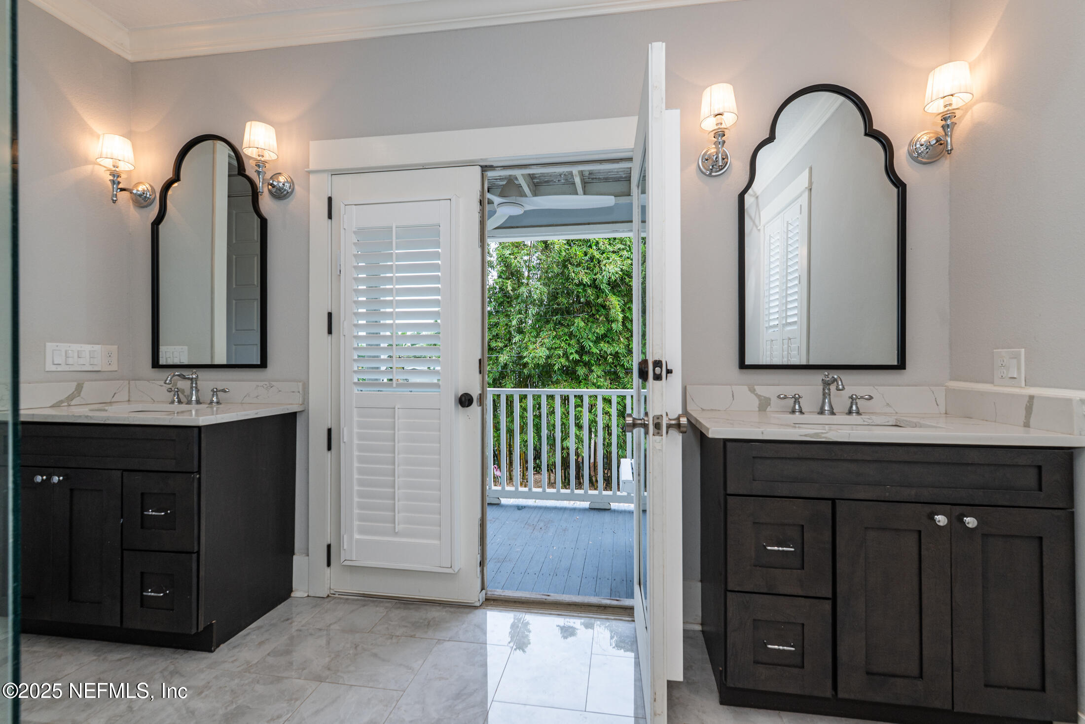 56 Water Street St. Augustine, FL 32084 - Photo 39 of 61 a bathroom with a double vanity sink and a mirror