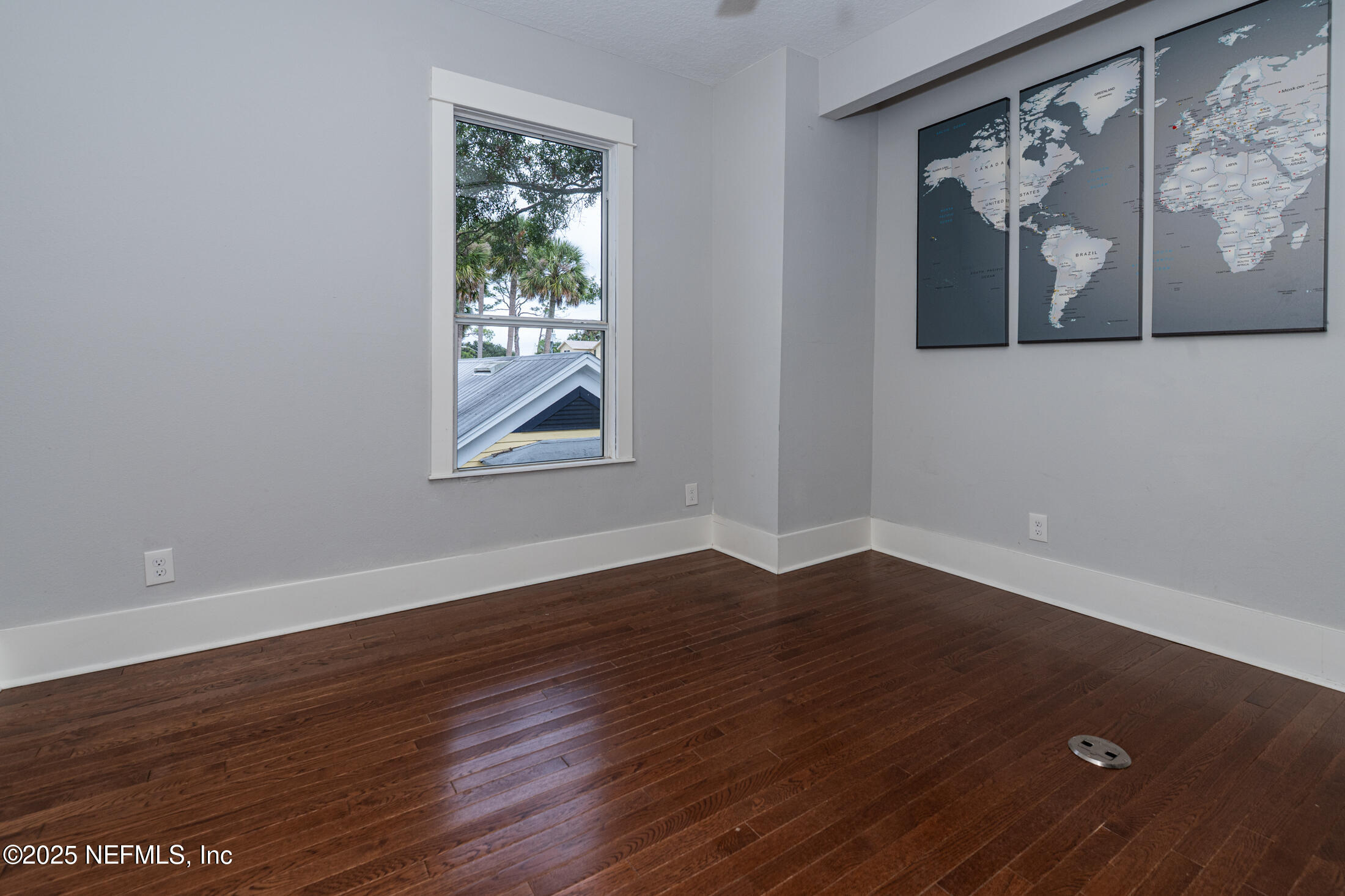 56 Water Street St. Augustine, FL 32084 - Photo 45 of 61 a view of an empty room with wooden floor and a window