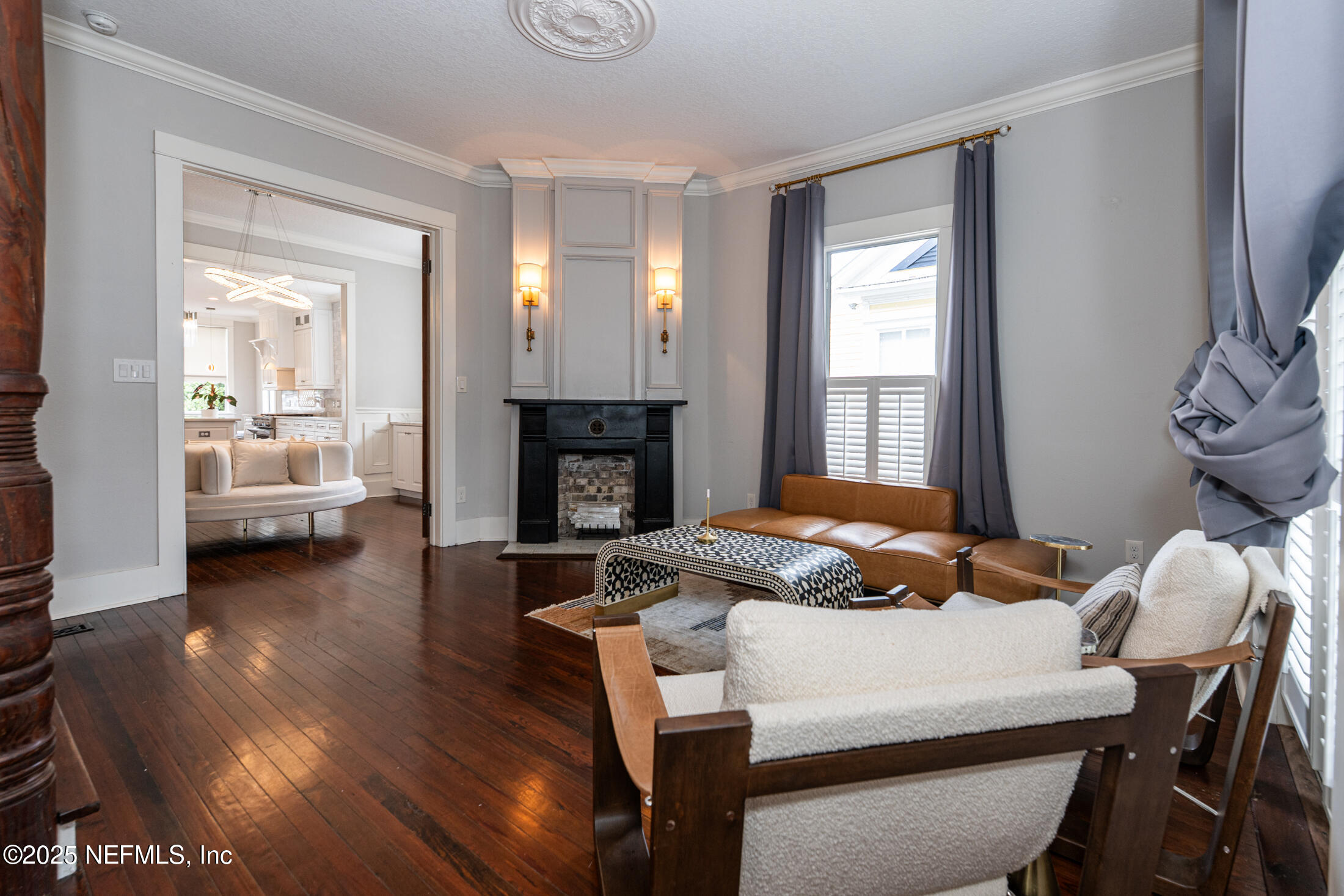 56 Water Street St. Augustine, FL 32084 - Photo 5 of 61 a bedroom with a bed and a fireplace