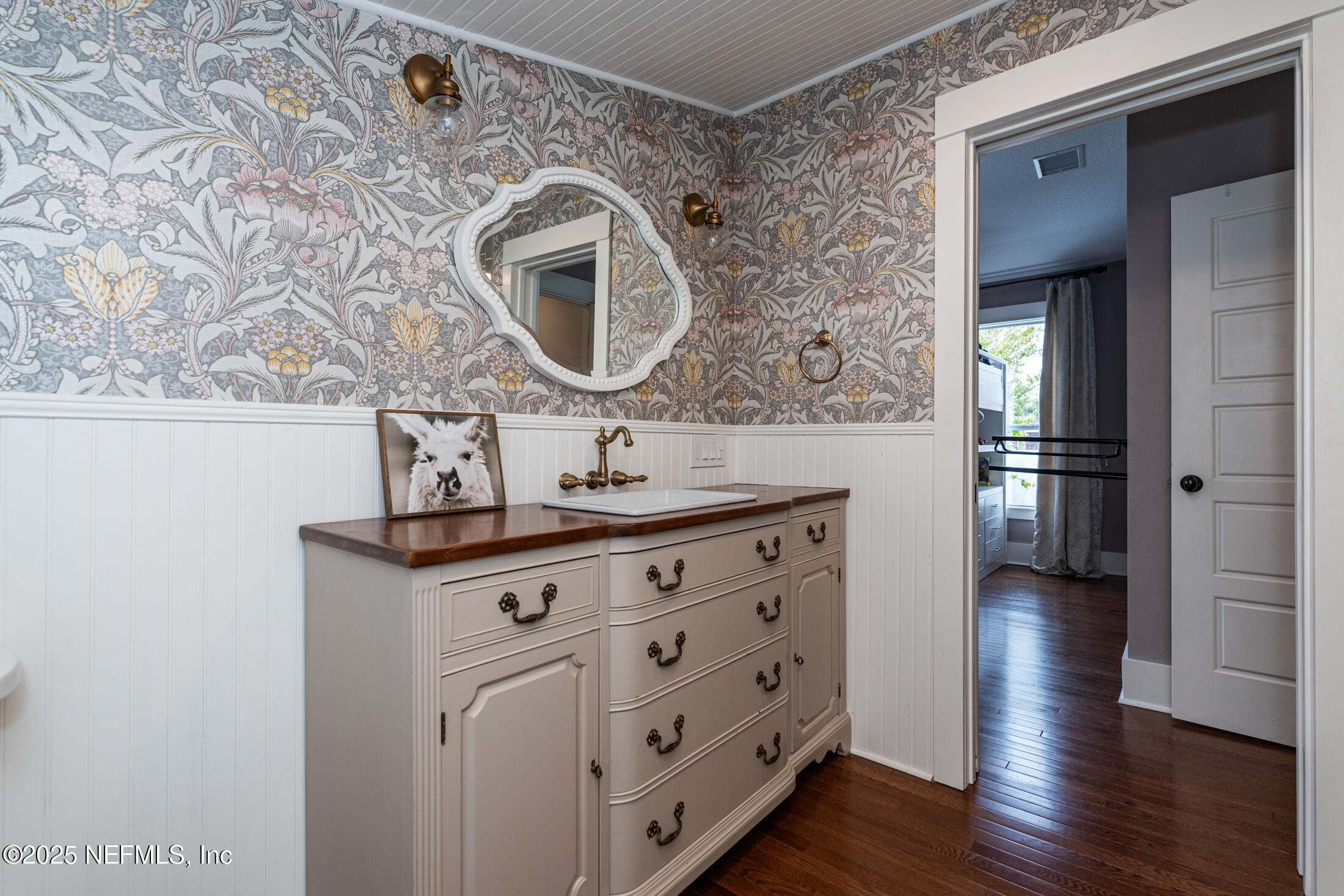 56 Water Street St. Augustine, FL 32084 - Photo 54 of 61 a bathroom with a sink and a mirror