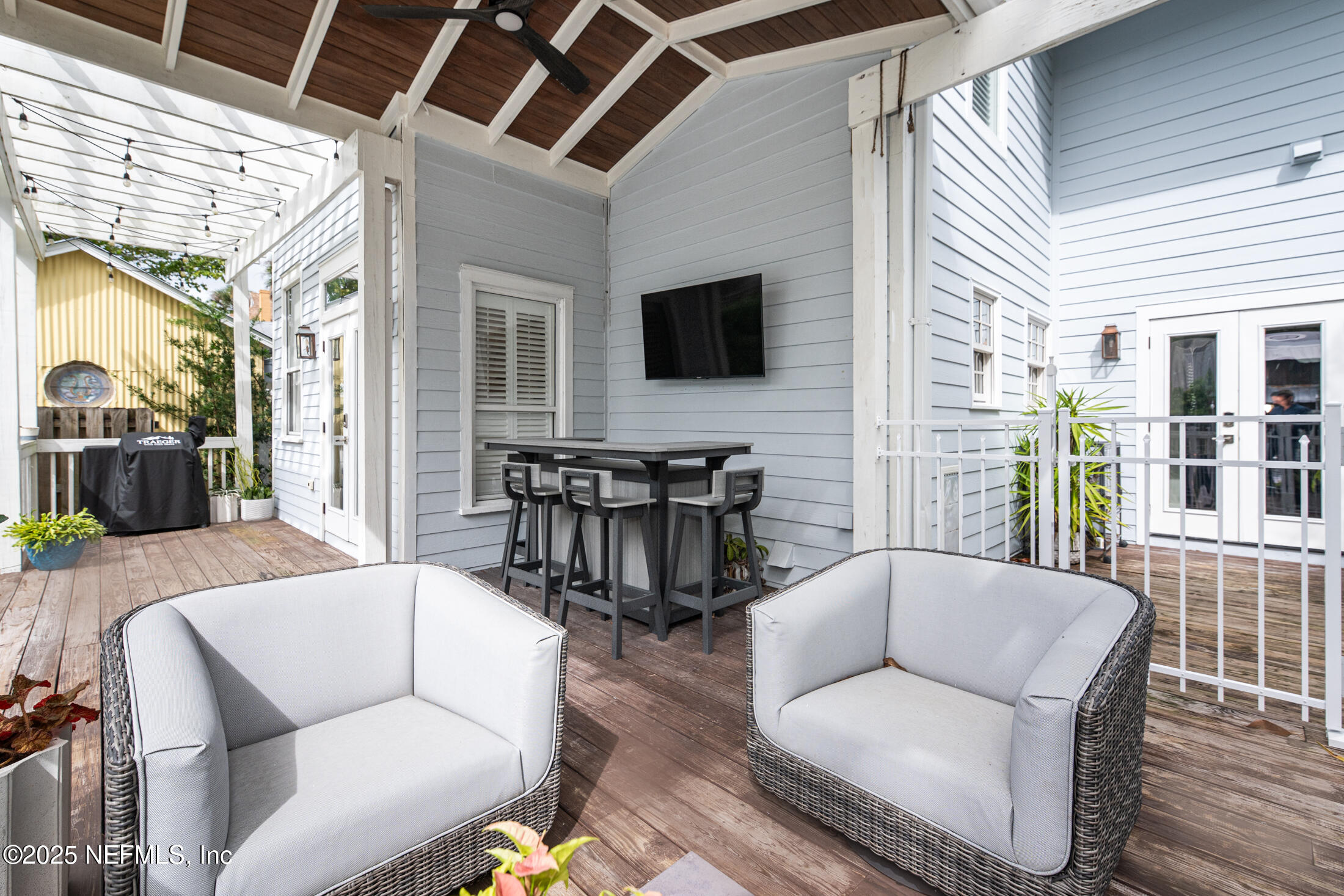 56 Water Street St. Augustine, FL 32084 - Photo 58 of 61 a living room with furniture and a flat screen tv
