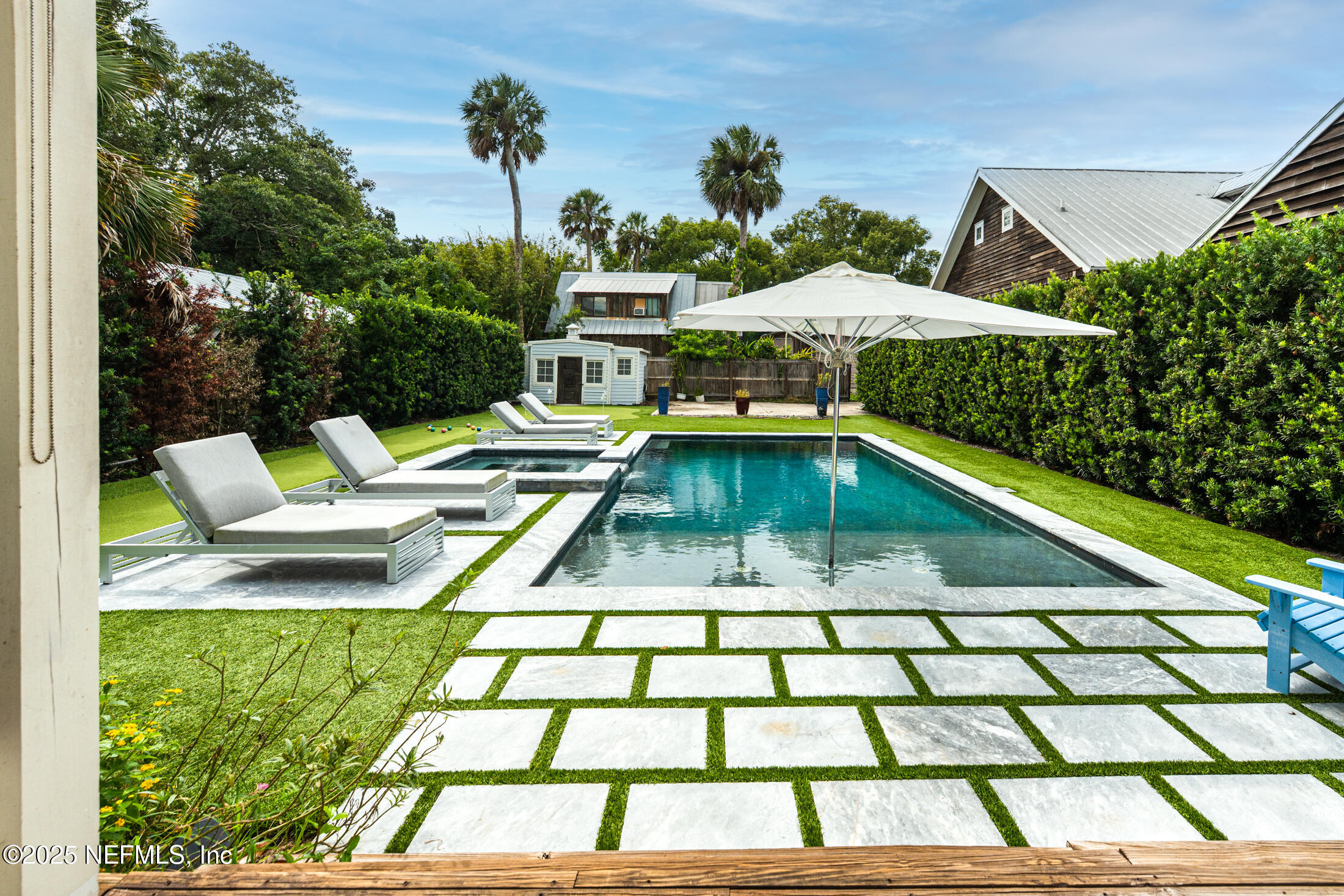 56 Water Street St. Augustine, FL 32084 - Photo 59 of 61 a view of swimming pool with seating space