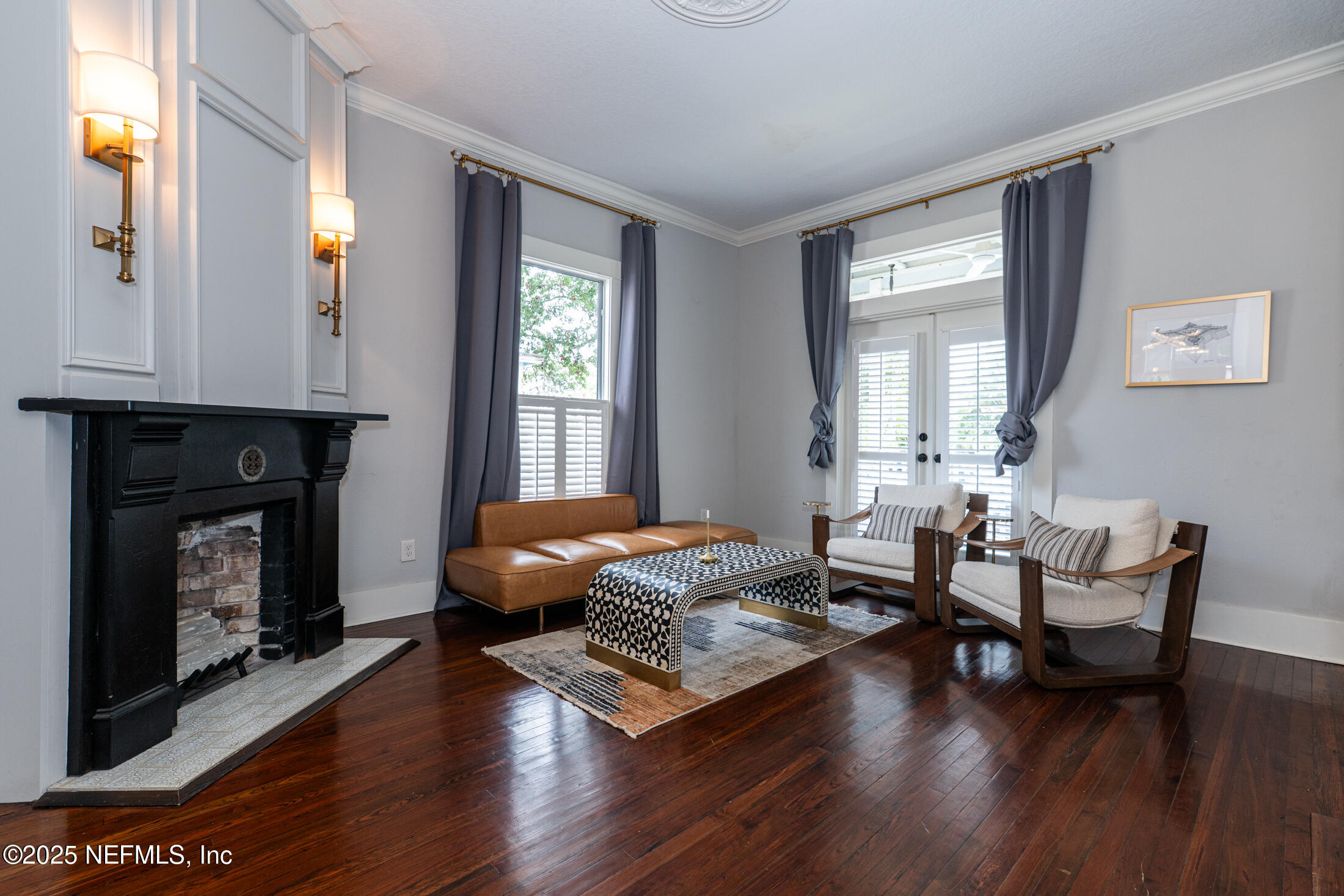 56 Water Street St. Augustine, FL 32084 - Photo 6 of 61 a living room with furniture and a fireplace